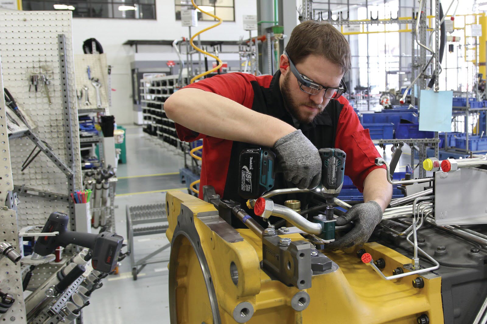 Image; AGCO workers use Glass to see assembly instructions, make reports and get remote video support.